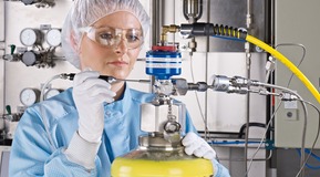 Employee in the clean room at the electronic gases plant in Unterschleißheim - Germany is carrying out a leak detection test.